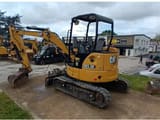 2020 Caterpillar 303.5E CR crawler excavator, rear three-quarter view