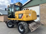 2011 Caterpillar M313D wheel excavator rear three-quarter view