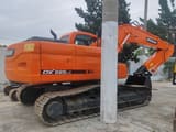 2019 Doosan DX225LC crawler excavator, rear three-quarter view