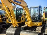 2020 Komatsu PC55MR-5 mini excavator, front three-quarter view