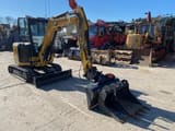 2023 Caterpillar 303CR mini excavator, front three-quarter view