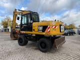 2010 Caterpillar M316D wheel excavator, rear three-quarter view