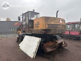 1990 CASE 1088 P wheel excavator, rear three-quarter view