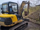 2001 Caterpillar 304.5 mini excavator, rear three-quarter view