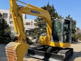 2023 Komatsu PC78US-6 mini excavator, front three-quarter view