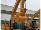 2025 Caterpillar 320GX crawler excavator, front three-quarter view