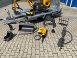 Berger Kraus BK1000JS mini excavator on trailer with attachments