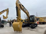 2024 Caterpillar 323D crawler excavator, front three-quarter view