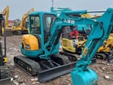 Kubota KX135 mini excavator, side view