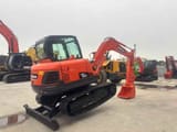 2024 Doosan DX60 mini excavator rear three-quarter view