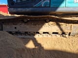 2016 Kobelco SK210 crawler excavator undercarriage view
