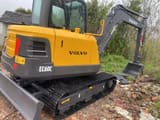 2023 Volvo EC60C mini excavator, rear three-quarter view