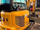 2023 Caterpillar 302.7CR mini excavator, rear three-quarter view