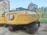 2025 Caterpillar 320GX crawler excavator, rear three-quarter view