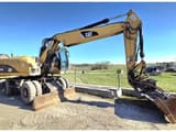 2009 Caterpillar M318D wheel excavator, side view