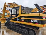 2014 Caterpillar 320BL crawler excavator, side view