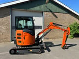 Hitachi ZX26U-6CR mini excavator, side view
