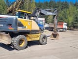 1999 Volvo EW160 wheel excavator, rear three-quarter view