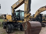 2013 Caterpillar M316D wheel excavator, front three-quarter view
