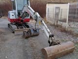 2012 Takeuchi TB 228 mini excavator, front three-quarter view