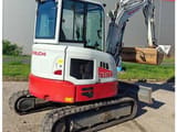 2024 Takeuchi TB 335 R mini excavator, rear three-quarter view