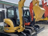 2024 Caterpillar 303.5E mini excavator, rear three-quarter view