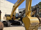 Komatsu PC450-8 crawler excavator, front three-quarter view