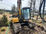 2021 Caterpillar 313 crawler excavator, front three-quarter view