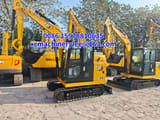 2025 Caterpillar 305.5 mini excavator, front three-quarter view