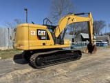 2018 Caterpillar 320 crawler excavator, rear three-quarter view