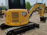 2023 Caterpillar 303.5E mini excavator, rear three-quarter view