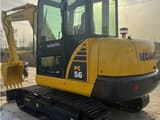 2024 Komatsu PC56-7 mini excavator, rear three-quarter view