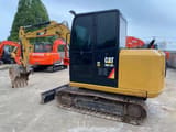 2022 Caterpillar 305.5E2 excavator, rear three-quarter view