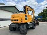 2015 Liebherr A914 wheel excavator, rear three-quarter view