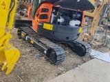 Kubota U-30 mini excavator, rear view with engine compartment open