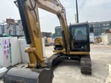 2021 Caterpillar 308E mini excavator, front three-quarter view
