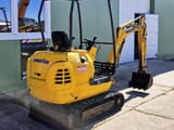 2002 Komatsu PC12R-8 mini excavator, rear three-quarter view
