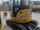 2023 Caterpillar 303.5E mini excavator rear three-quarter view