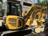 2023 Komatsu PC-55MR mini excavator, rear three-quarter view