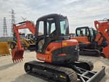 2024 Kubota U55-4 mini excavator, front three-quarter view