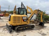 2022 Caterpillar 306E mini excavator, rear three-quarter view