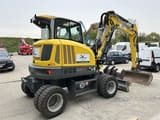 2023 Wacker Neuson EW65 wheel excavator, rear three-quarter view