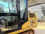 2024 Caterpillar 313GC crawler excavator cab and side view