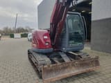 2005 New Holland E70 mini excavator, front three-quarter view
