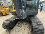 2023 Volvo EC55D mini excavator, front view of cab and tracks