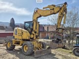 2013 Komatsu PW118 MR-8 wheel excavator, side profile view