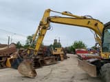 2007 Komatsu PW140-7 wheel excavator, side view of boom and bucket