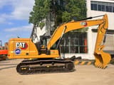 2023 Caterpillar 320GC crawler excavator, side profile view