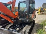 2023 Doosan DX60-9C crawler excavator, front three-quarter view