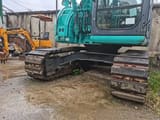 2015 Kobelco SK125SR crawler excavator, side view of undercarriage and cab